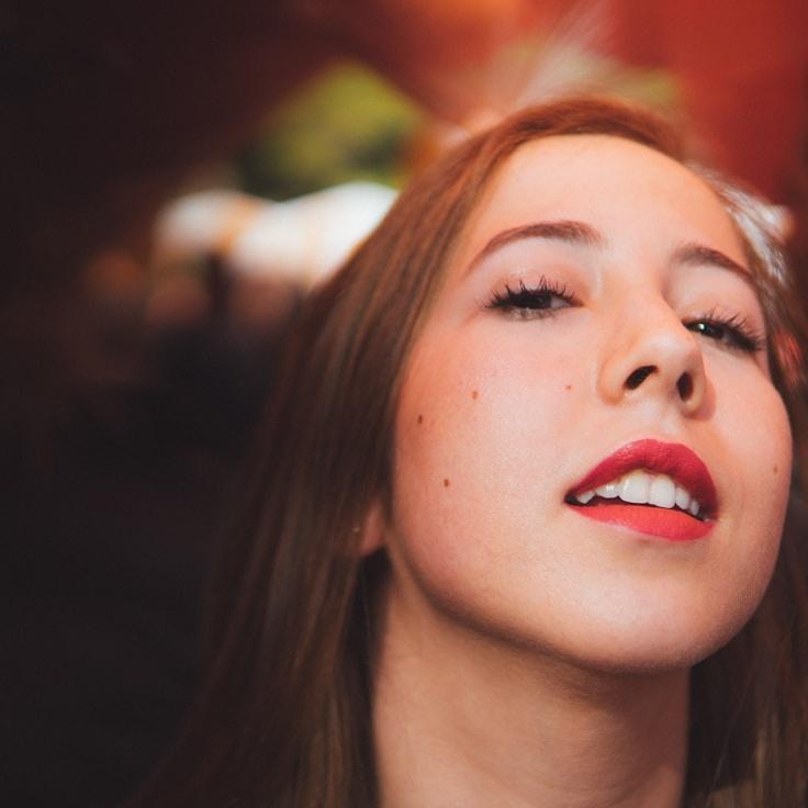 Avery Kim, Lead Design Curator at MellowPathSignal, reviewing corporate floral arrangements